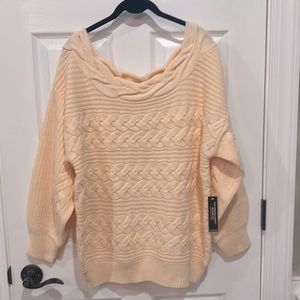 Peach colored cable-knit, oversized sweater. Size large